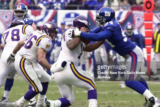 New York Giants' defensive end Cedric Jones hits Minnesota Vikings quarterback Daunte Culpepper in the NFC Championship Game at Giants Stadium. The...