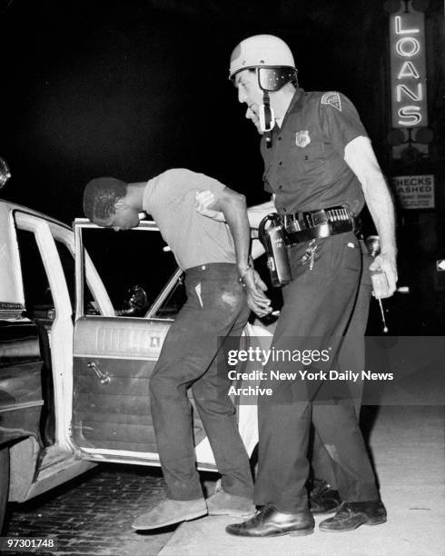 Newark Police arrest a looter at Springfield Ave. And Mercer St. During riots.