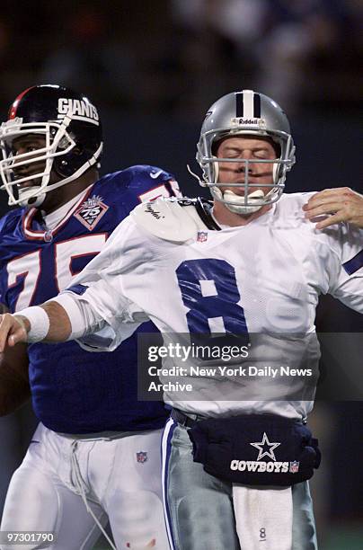 Dallas Cowboys' quarterback Troy Aikman after he was sacked by New York Giants' Keith Hamilton in the fourth quarter at Giants Stadium. Giants won,...