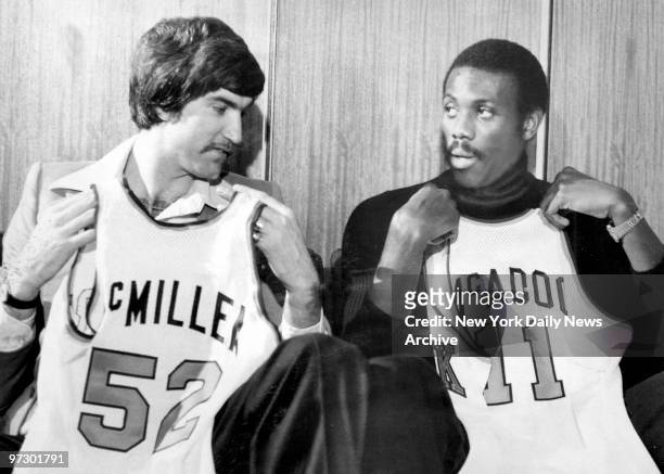 Newest Knicks, Tom McMillen and Bob McAdoo, obtained from Buffalo in $3 million deal, display uniform numbers they'll waer.