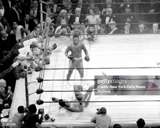 Joe Frazier knocks down Muhammad Ali in the 15th round at Madison Square Garden.