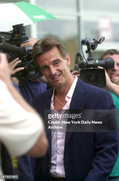 Daniel Pelosi is surrounded by the media as leaves courthouse in Central Islip, Long Island, after he was charged for stealing electricity from the...