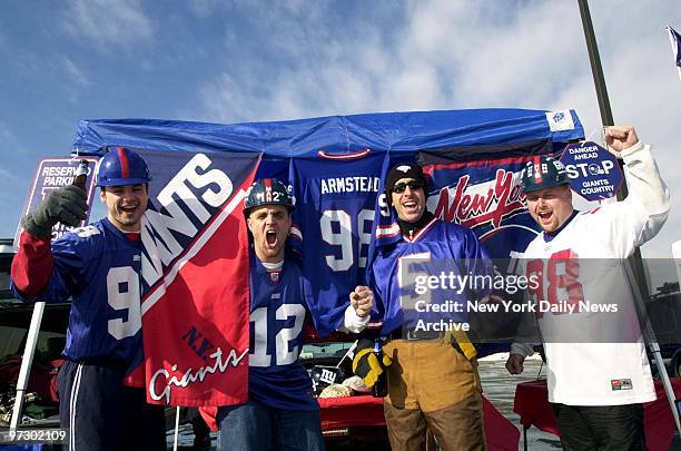 New York Giants' fans Ed Kopera, Jerry Foley, Dan Graziano and Matt Bucchere are already cheering at tailgate party in parking lot before their team...