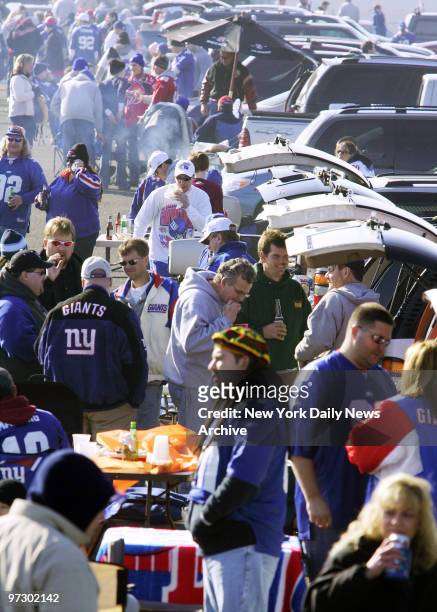 New York Giants fans enjoy themselves during the tailgating celebration before the NFC Wild Card playoff game against the Carolina Panthers at Giants...