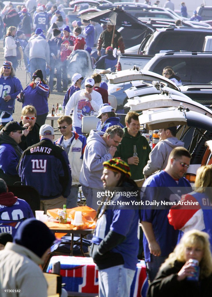 New York Giants fans enjoy themselves during the tailgating