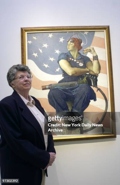 Mary Keefe stands next to Norman Rockwell's painting "Rosie the Riveter" at Sotheby's auction house. Keefe was a nineteen-year-old telephone operator...