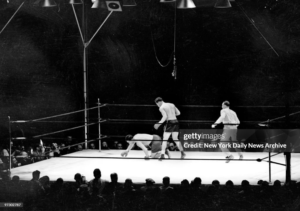 Joe Louis vs Max Schmeling., Max spins as he plunges toward 