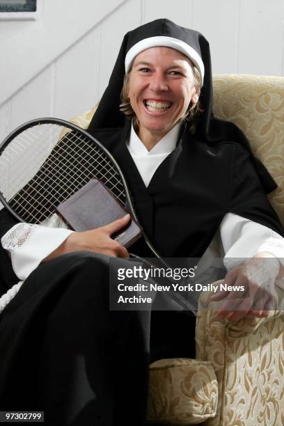 Sister Andrea Jaeger cradles her brown leather Bible and a tennis racket inside a cottage at a bed-and-breakfast in Afton, Va., where she is staying...