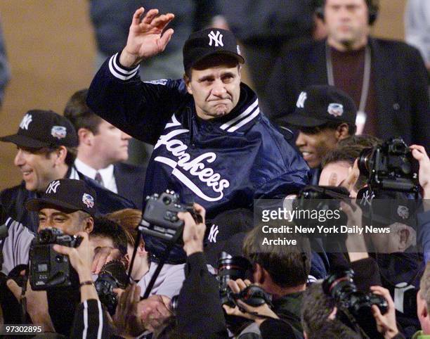 New York Yankees' Manager Joe Torre waves to fans after the Yankees beat the New York Mets in the Subway World Series at Shea Stadium.