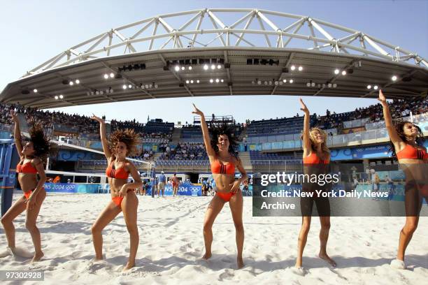 Cheerleaders strut their stuff during beach volleyball matches at the Faliro Coastal Zone Olympic Complex during the 2004 Summer Olympic Games in...