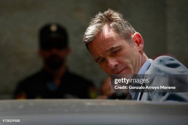 Former Olympic handball player and husband of Spain's Princess Cristina, Inaki Urdangarin leaves the courthouse on June 13, 2018 in Palma de...