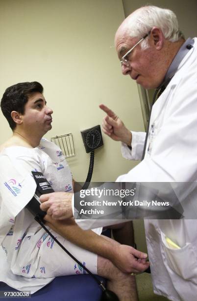 Site safety inspector Bruce Altimar is examined by Dr. William Schneider at a medical screening clinic for World Trade Center rescue workers at Mt....