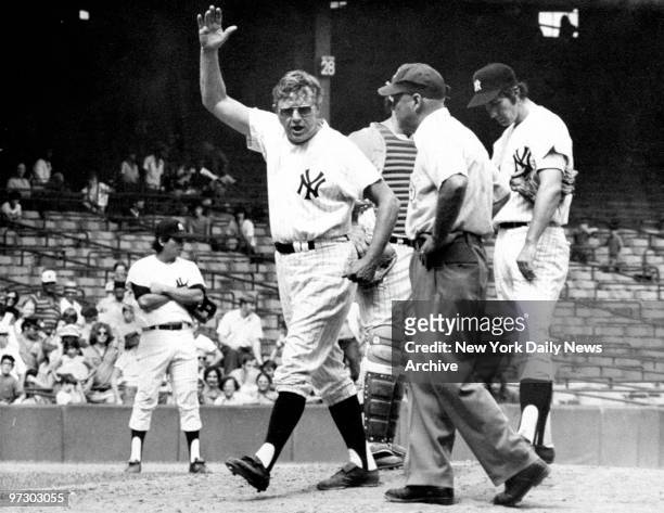 New York Yankees' manager Ralph Houk vents his frustration over a call with first base umpire Marty Springstead during a game against the Kansas City...