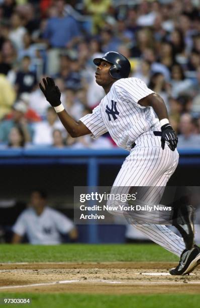 New York Yankees' Marcus Thames hits a two-run homer in his first at-bat in the third inning of game against the Arizona Diamondbacks at Yankee...