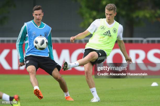 Matthias Ginter and Julian Draxler battle for the ball during the Germany training session ahead of the 2018 FIFA World Cup at CSKA Sports Base on...