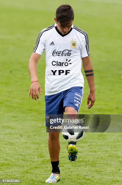 Paulo Dybala of Argentina kicks the ball during a training session at the team base camp on June 13, 2018 in Bronnitsy, Russia.