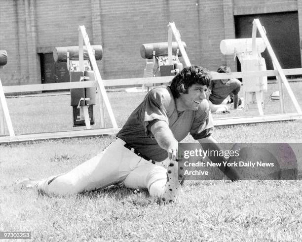 Joe Namath does some exercise on the field at Hofstra University in Hempstead, L.I.