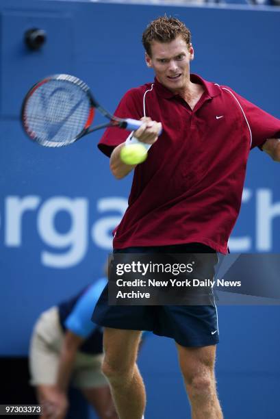Sjeng Schalken of the Netherlands returns ball to Andy Roddick of the U.S. During first set of a quarterfinal match at the U.S. Open in Flushing...