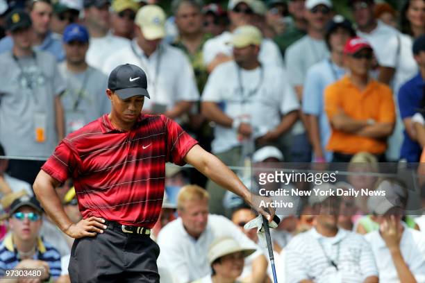 Tiger Woods of the U.S. Waits to tee off at the first hole during the fourth round of play in the 87th PGA Championship at Baltusrol Golf Club in...