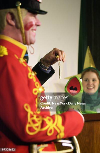 Soldier can't help but smile as Kermit the Frog reacts to getting the golden key to Macy's from Robin Hall , producer of the annual Macy's...