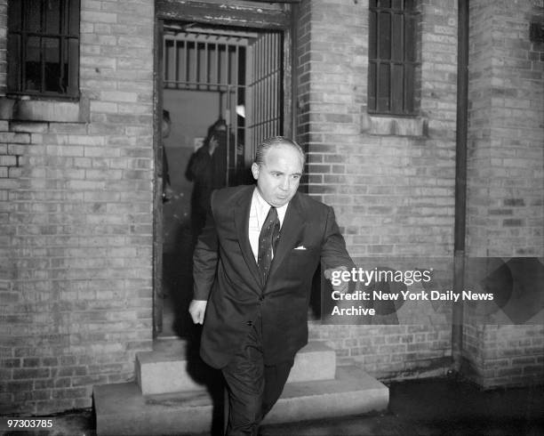 Gangster Mickey Cohen hastens from court after posting bail.