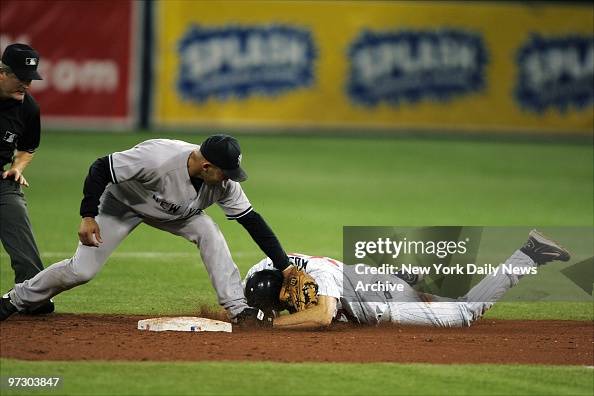 New York Yankees' Miguel Cairo puts the tag on Minnesota Twi New York Yankees' Miguel Cairo puts the tag on Minnesota Twi
