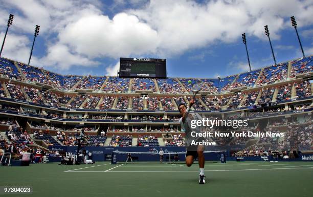 Tim Henman of Britain chases down a lob by Nicolas Kiefer of Germany during their fourth round match in Arthur Ashe Stadium at the U.S. Open....