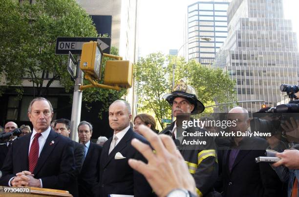 Mayor Michael Bloomberg and Police Commissioner Raymond Kelly listen to a question during a news conference after two crude grenades exploded outside...