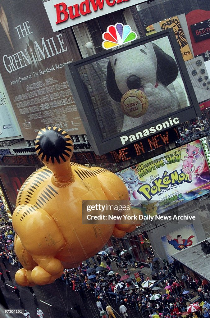 Garfield the cat passes Snoopy on the way down Times Square 