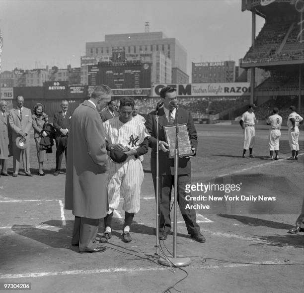 Daily News Sportswriter Joe Trimble presents Babe Ruth Memorial Award to Phil Rizzuto, Commissioner of Baseball Ford Frick presents the World Series...