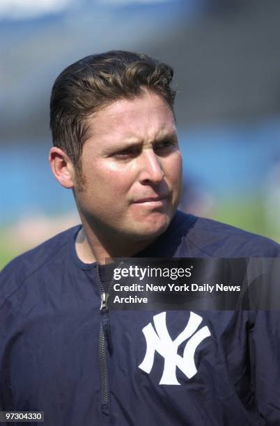 New York Yankees' new outfielder Karim Garcia warms up on the field at Yankee Stadium before taking on the New York Mets in the third game of the...