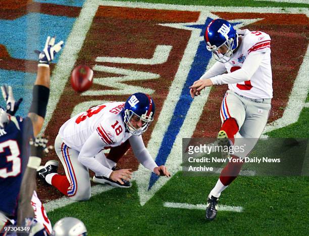 New York Giants' place kicker Lawrence Tynes nails a 32-yard field goal during the first quarter of Super Bowl XLII against the New England Patriots...