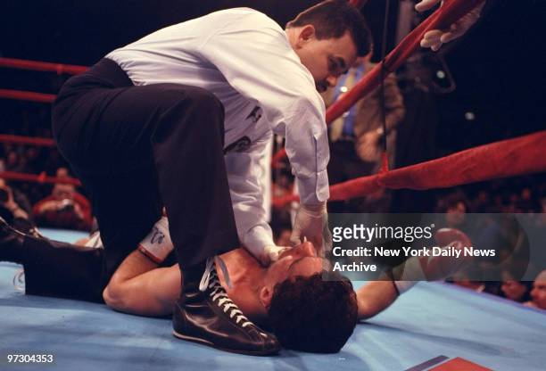 Joey Gamache is attended by official after being knocked out by Arturo Gatti at Madison Square Garden.