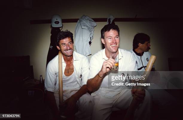 New Zealand players Richard Hadlee and John Bracewell celebrate in the dressing room with a drink after their victory in the Second Test Match...