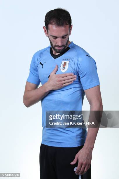 Diego Godin of Uruguay poses for a portrait during the official FIFA World Cup 2018 portrait session at Borsky Sport Centre on June 12, 2018 in...