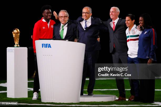 The succesful United 2026 bid officials pose on stage after the announcement of the host for the 2026 FIFA World Cup went to United 2026 bid during...