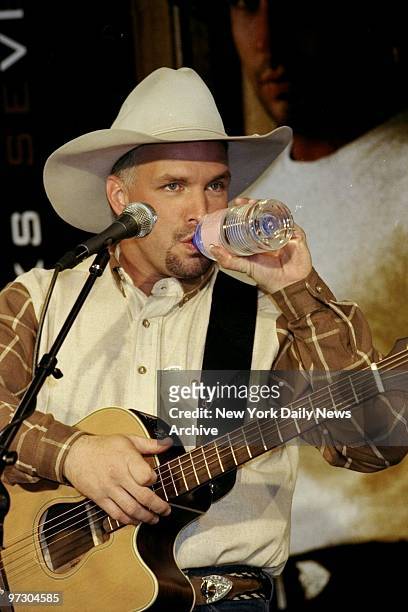 Garth Brooks singing at the K-Mart Astor Place store to promote his new album "Sevens." ,