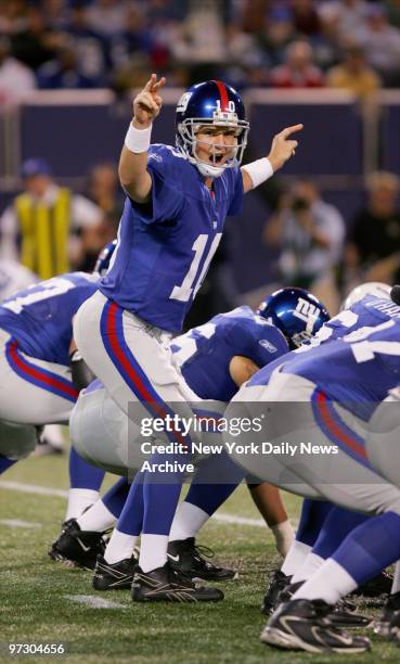 New York Giants' quarterback Eli Manning calls out plays on the line during a game against the Indianapolis Colts at Giants Stadium. The Giants went...