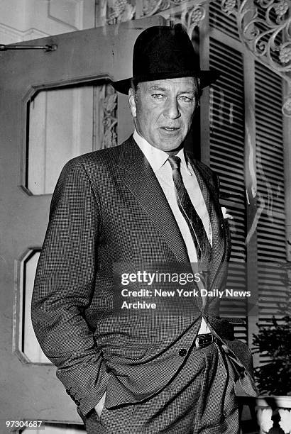 Gary Cooper leaving the Harwyn Club after luncheon.