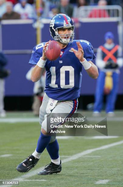 New York Giants quarterback Eli Manning fades back to pass for a touchdown in the opening minutes of the fourth quarter against the Philadelphia...