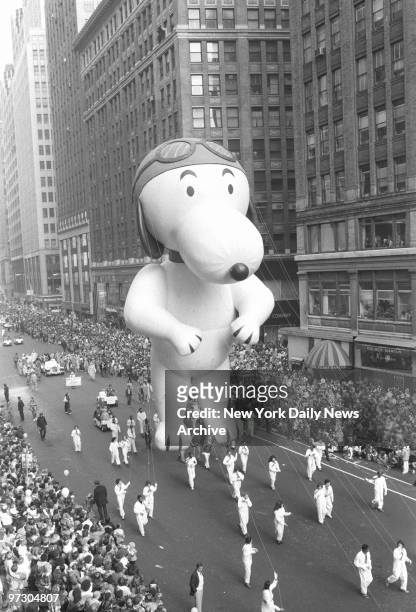 Snoopy floats above Broadway as Macy's 53d annual Thanksgiving Day parade moves down Broadway with its floats and hoopla and enough giant helium...