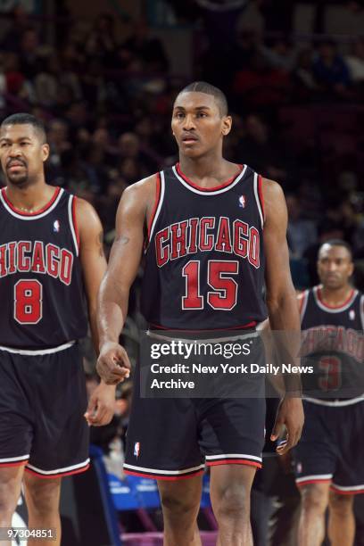 Chicago Bulls' Dickey Simpkins, Ron Artest and Hersey Hawkins are on the court during a game against the New York Knicks at Madison Square Garden.