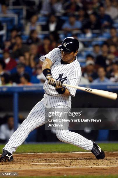 New York Yankees' outfielder Hideki Matsui hits a solo homer to right field during the second inning of game against the Tampa Bay Devil Rays at...