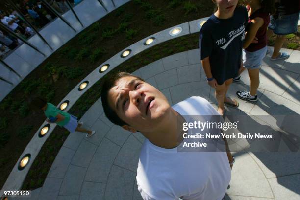 John Benas of Purchase, looks up into the center of Westchester County's 9/11 memorial called The Rising, at Kensico Dam Plaza, the day before the...