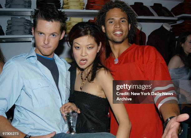 Damien Fahey, SuChin Pak and MTV veejay Quddus emote at a party at the New Express Flagship store on lower Broadway.