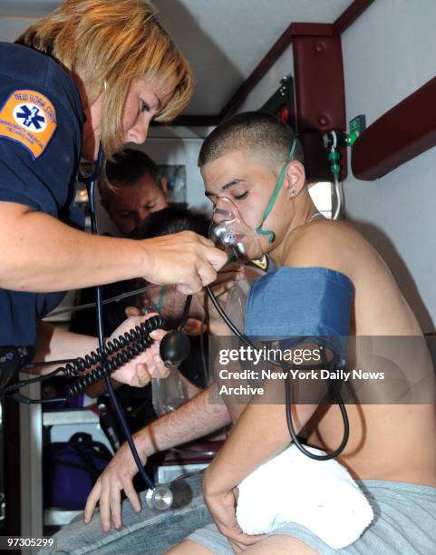 Damien Maldonado is treated for smoke inhalation after he ran back into a burning house to save two ferrets, Snickers and Pebbles. Two teenagers, two...