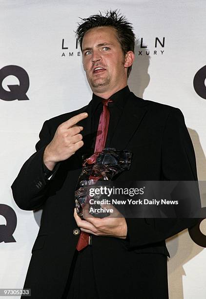 Matthew Perry holds his award at GQ's fifth annual "Men Of The Year" Awards honoring men of distinction at the Beacon Theater. Perry was honored for...