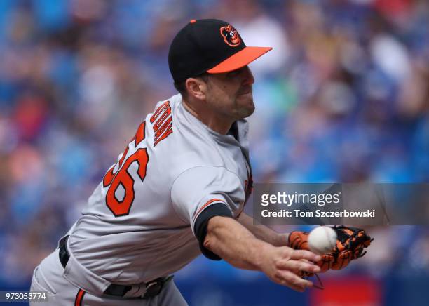 Darren O'Day of the Baltimore Orioles delivers a pitch in the eighth inning during MLB game action against the Toronto Blue Jays at Rogers Centre on...