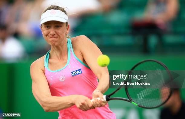 Mona Barthel of Germany hits a backhand during her second round match against Magdalena Rybarikova of Slovakia on Day Five of the Nature Valley Open...