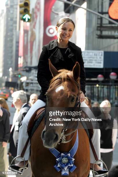 Georgina Bloomberg, daughter of Mayor Bloomberg, sits atop a horse in front of the NASDAQ building in Times Square, where she spoke of her hopes to...